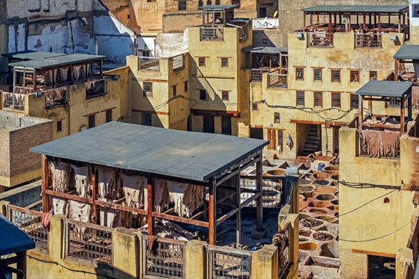 Sidi Moussa Tannery with round stone vessels filled with dye and softening liquids in medina Fes el-Bali of the city Fes