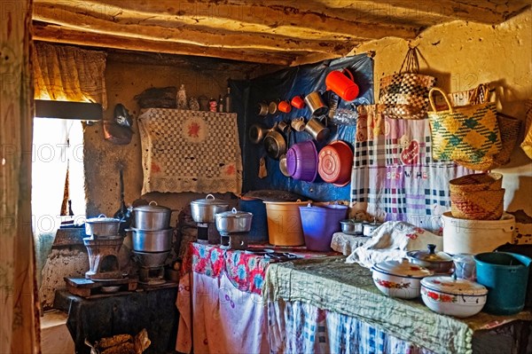 Interior of Betsileo house showing kitchen with pots and cooking utensils in the Haute Matsiatra Region