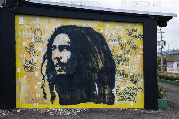 Bob Marley mural with song titles