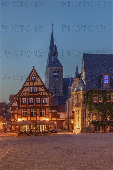 Cafe on the market square with St Benedikti church and town hall