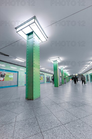 Alexanderplatz underground station with green columns and modern lighting