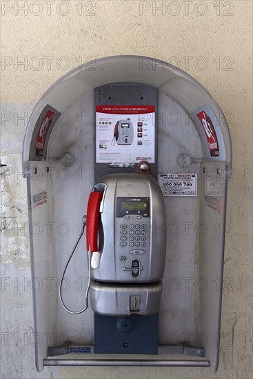 Public telephone booth under arcades