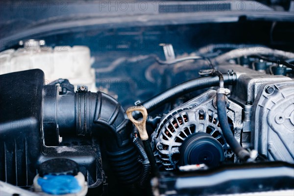 Generator in a car near an internal combustion engine