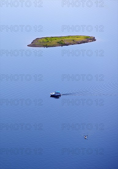 Aerial view of a small island and a leisure boat on the Edersee