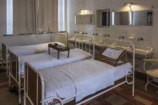 Hospital beds in the Dr Guislain Museum about the history of psychiatry in the former Guislain Hospice