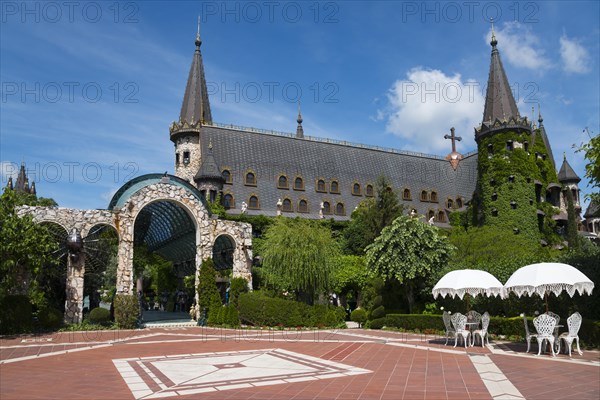 Fairytale castle with pointed towers under a sunny sky