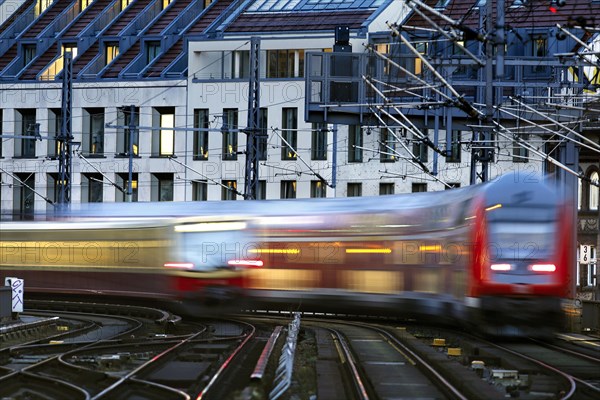 An S-Bahn train and a Deutsche Bahn regional express are photographed with a long exposure