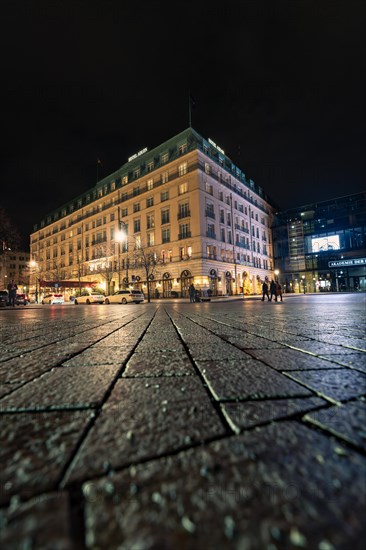 Urban scene at night in long exposure with human activity