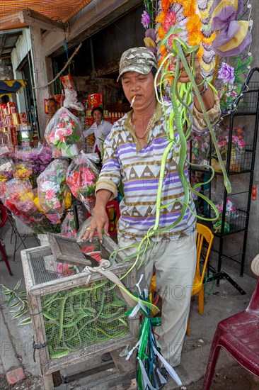 Man with snakes in his hand