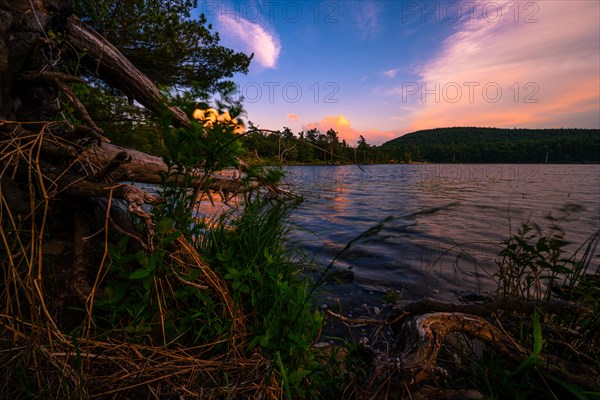 Summer Solstice Sunset on a lake in Catskills Mountains