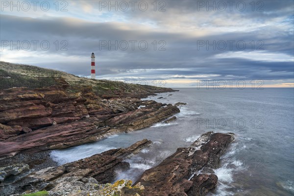 Tarbat Ness lighthouse on rocky cliffs