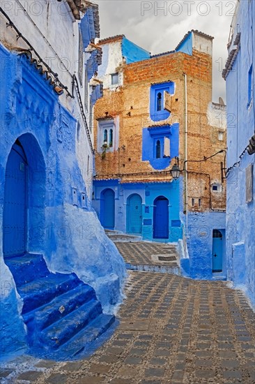 Narrow alleyway with blue walls