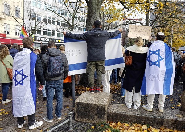 Participants in the demonstration Solidarity March with Israel show Israeli flags