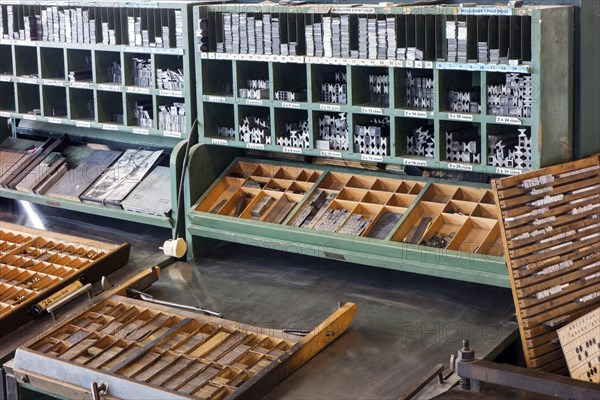 Type case in composing room at printing business