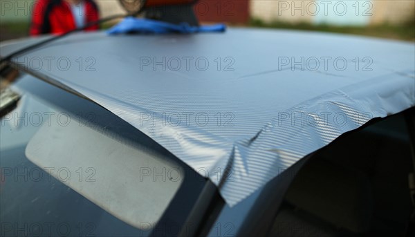 Covering the car body with carbon film