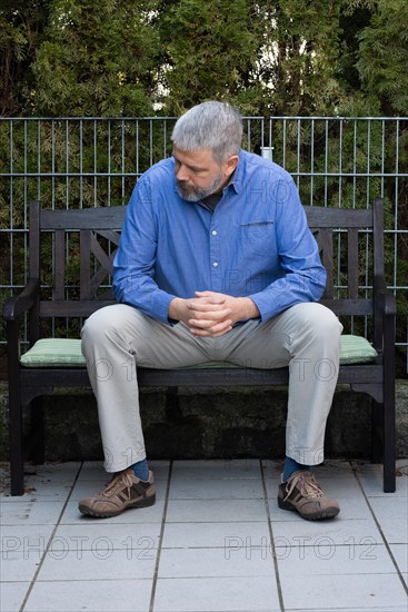 Man with grey hair and a full beard