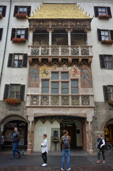 Tourists in front of the Golden Roof in the historic centre of Innsbruck