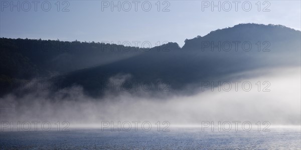 Edertalsperre with fog on the Edersee in the early morning