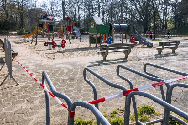 Deserted public children's playground closed and obstructed with tape due to the 2020 COVID-19