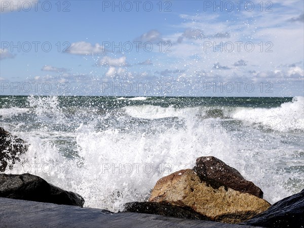 Waves crashing against a seawall