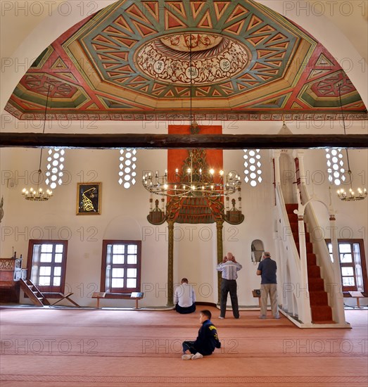 Worshippers pray in the royal mosque in Berat