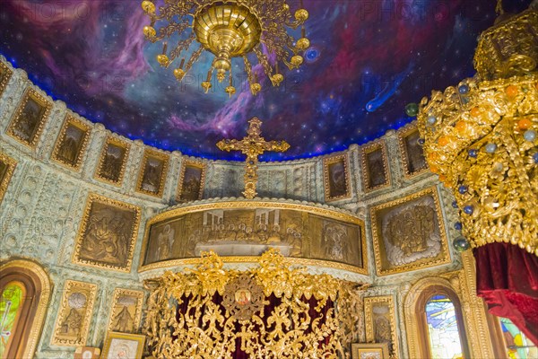 A magnificent church interior with golden chandeliers and icons