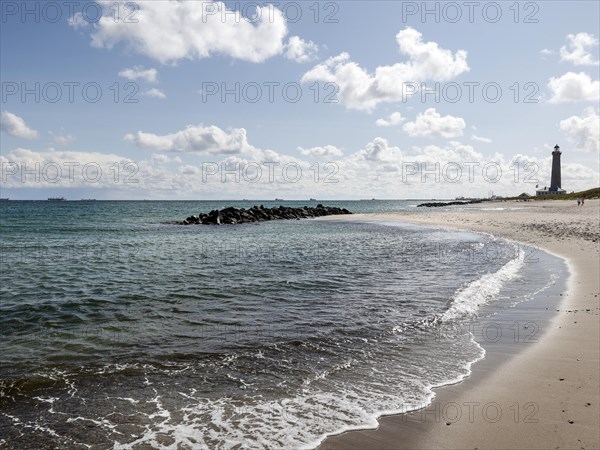 Baltic Sea beach with lighthouse in Skagen. Skagen is the only town in Denmark that lies on the North Sea and the Baltic Sea