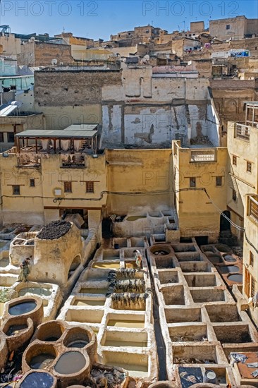 Sidi Moussa Tannery with round stone vessels filled with dye and softening liquids in medina Fes el-Bali of the city Fes