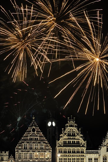 Colourful fireworks at night above the mediaeval facades at the Graslei