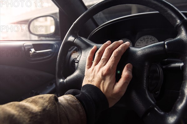 A man is driving a premium car