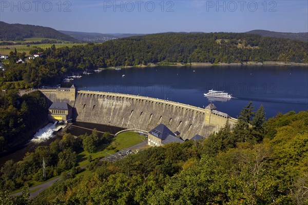 Aerial view of the Eder dam with the dam wall and a ship on the Edersee