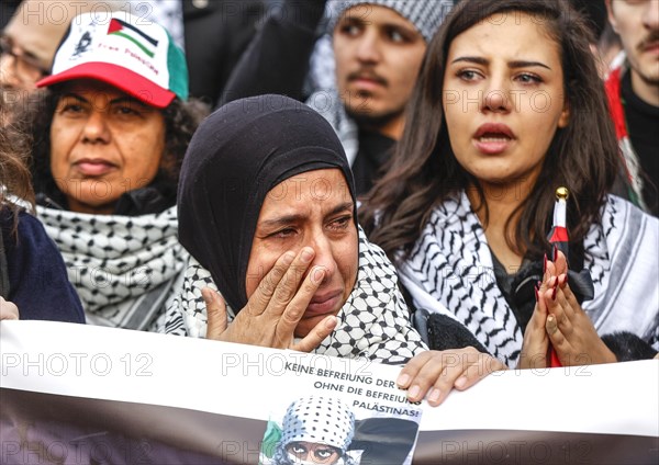 A woman cries during the Global South Unites demonstration. Palestinians and other participants gathered to protest against Israel's actions in the Gaza Strip and called for an immediate ceasefire