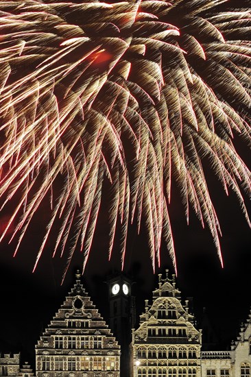 Colourful fireworks at night above the mediaeval facades at the Graslei