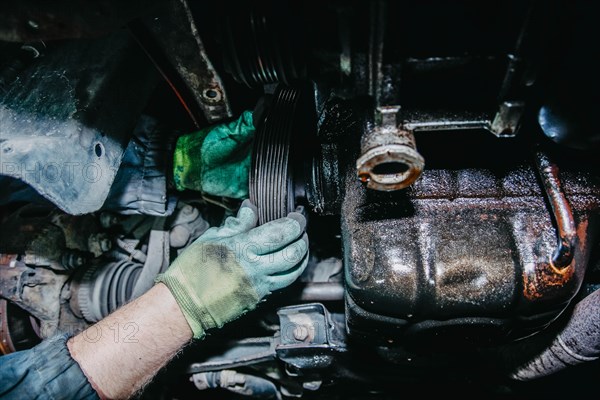 Car engine alternator belt replacement