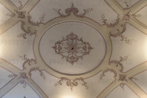 Detailed view of the historic stucco ceiling in the Palazzo Reale