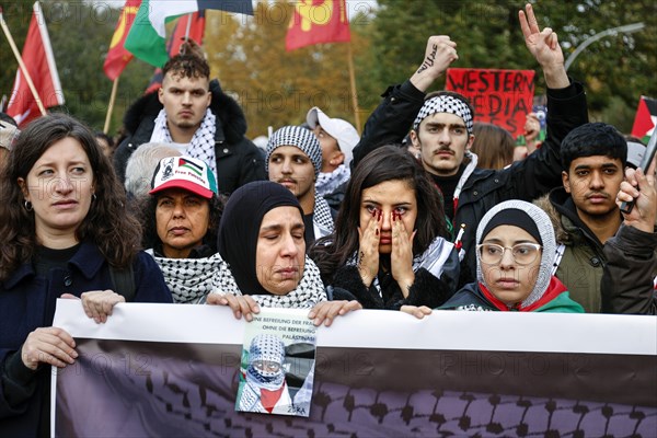 A woman cries during the Global South Unites demonstration. Palestinians and other participants gathered to protest against Israel's actions in the Gaza Strip and called for an immediate ceasefire