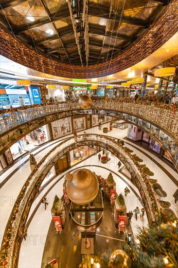View of the interior of a multi-storey shopping centre with Christmas decorations