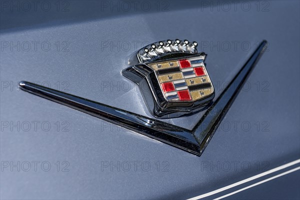 Logo Cadillac on vintage car Coupe DeVille at the rear