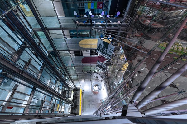 Interior of a modern building complex with escalators