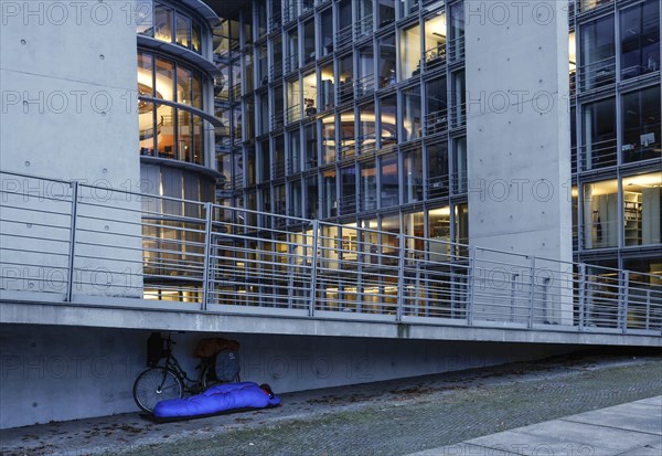 A homeless man sleeps in a sleeping bag at the Paul Loebe Haus. Aid organisations register an increase in homeless people