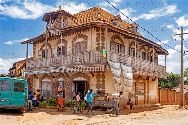 Old French colonial building with wooden balconies in the city Ambalavao