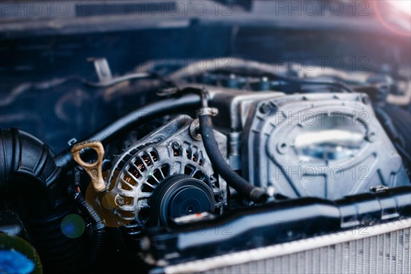 Generator in a car near an internal combustion engine