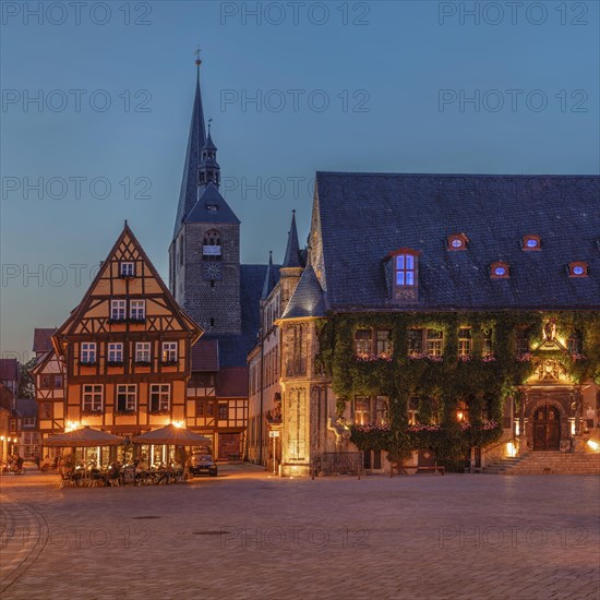 Cafe on the market square with St Benedikti church and town hall