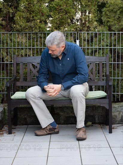 Man with grey hair and a full beard