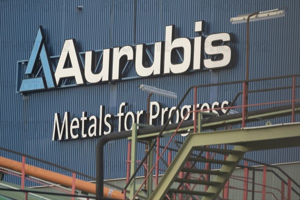 Logo and lettering Aurubis Metal for Progress on a factory building at the Aurubis AG plant