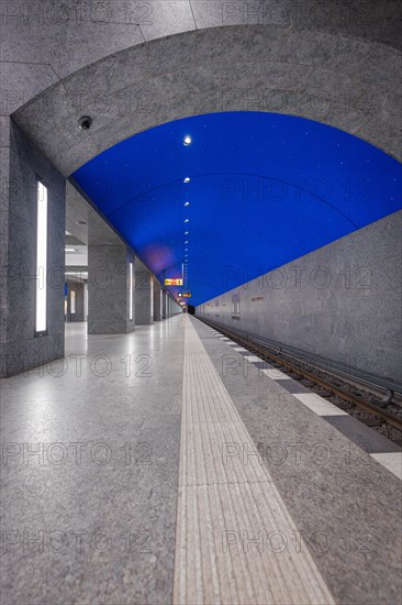 Underground station at night with simple design and clear blue sky