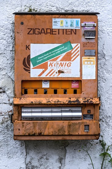 Rotten, rusty cigarette vending machine, device temporarily out of service due to youth protection, on a wall, protection, children, youth, Germany, Europe