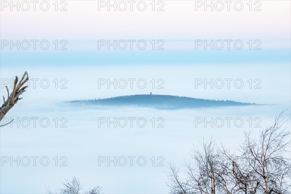 Landscape on the Grosser Feldberg, Taunus volcanic region. A cloudy, sunny winter day, meadows, hills, snow and forests with a view of the winter sunset. Hesse, Germany, Europe