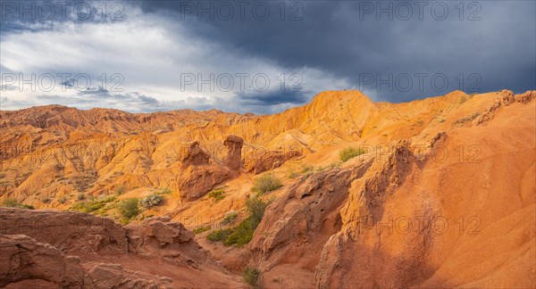 Eroded mountain landscape, sandstone cliffs, canyon with red and orange rock formations, Konorchek Canyon, Chuy, Kyrgyzstan, Asia