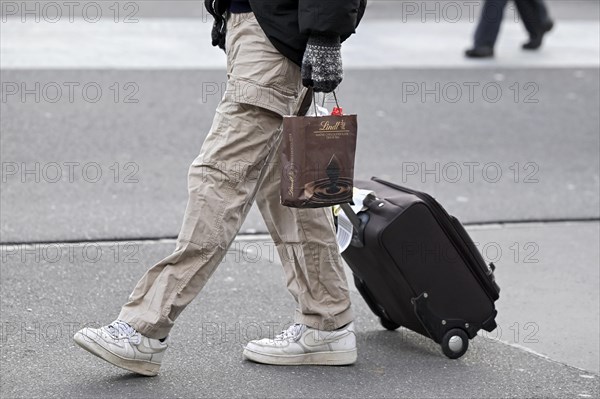 Man with trolley case